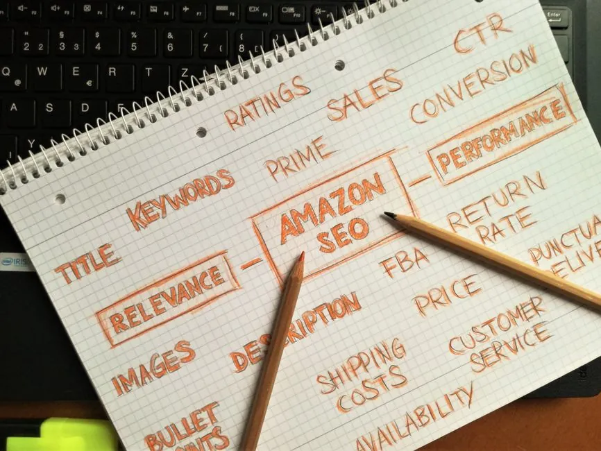 Person reviewing SEO pricing documents and a laptop showing analytics charts