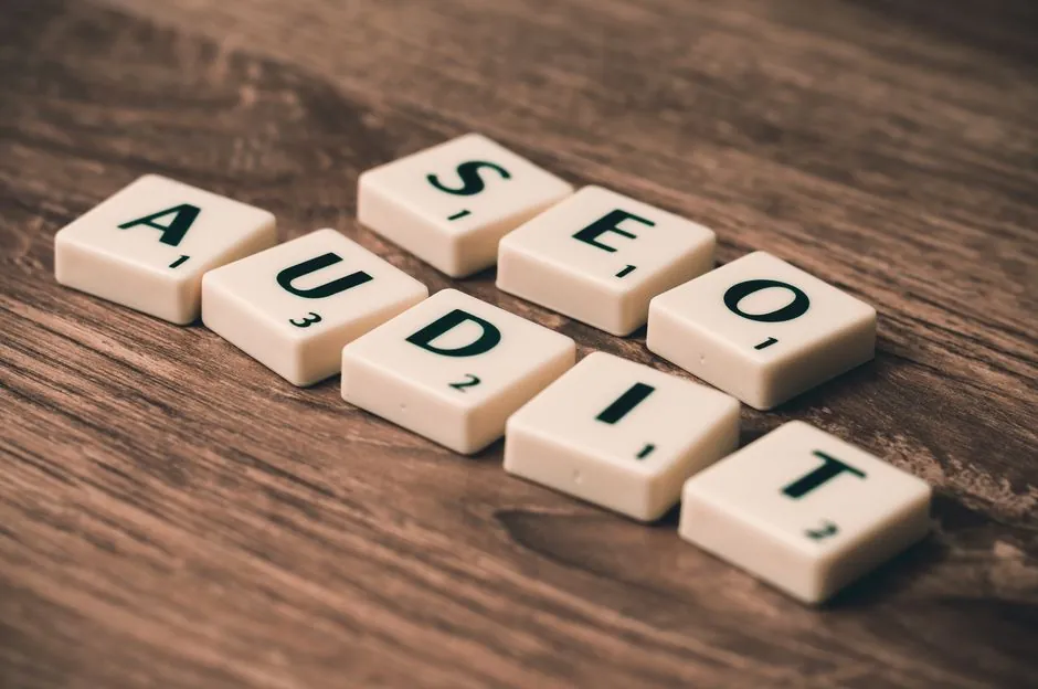 Close-up of a printed SEO audit report with highlighted sections and a pen
