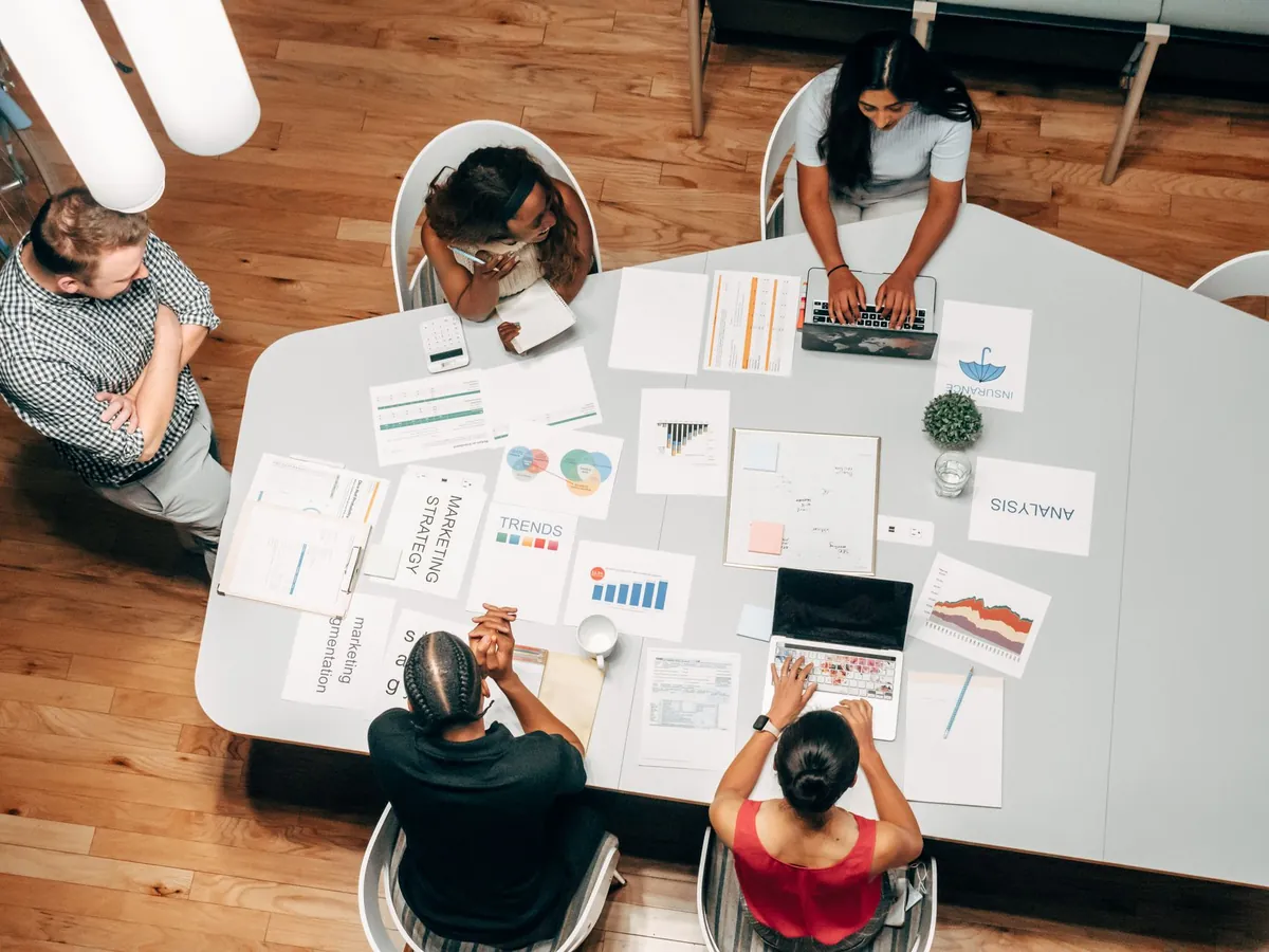 A business team meeting with a digital marketing agency consultant reviewing performance reports