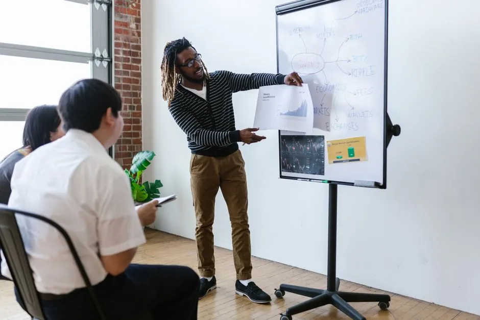 A digital marketing team planning a campaign on a whiteboard