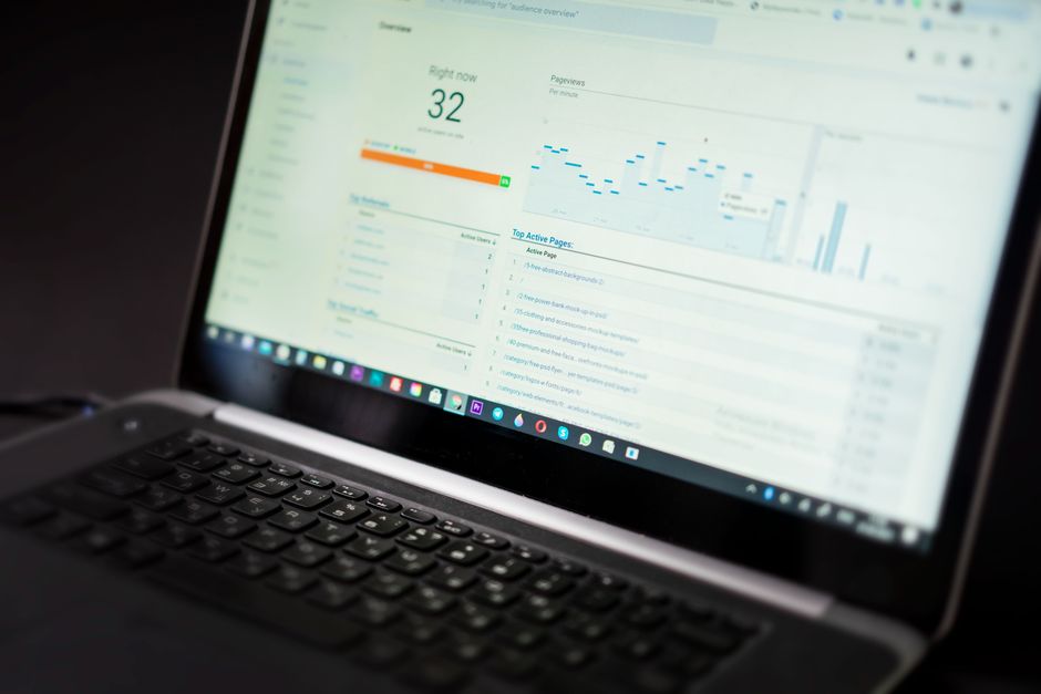 SEO analytics dashboard on a laptop showing search performance data
