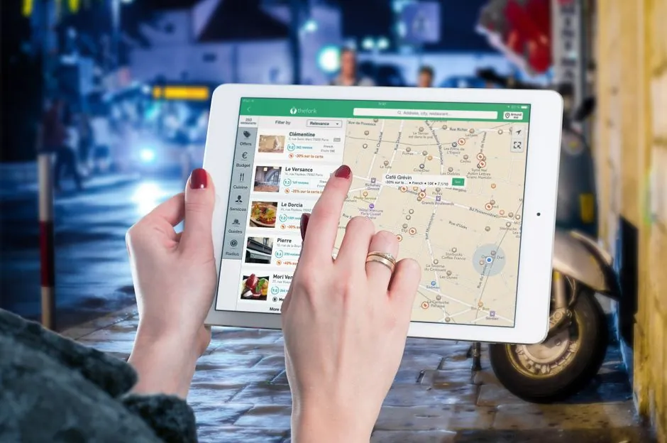 Person searching on smartphone showing local business results on a map