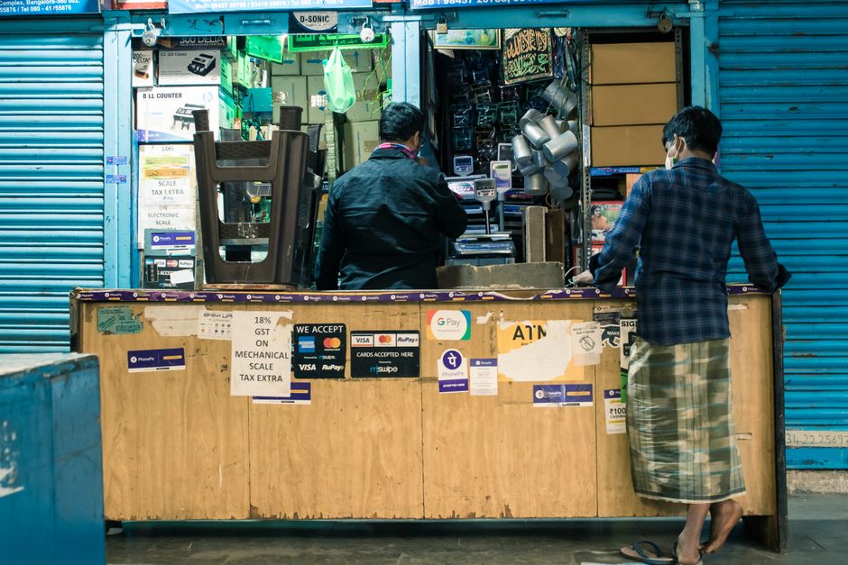 Local shop counter where a small business owner serves customers