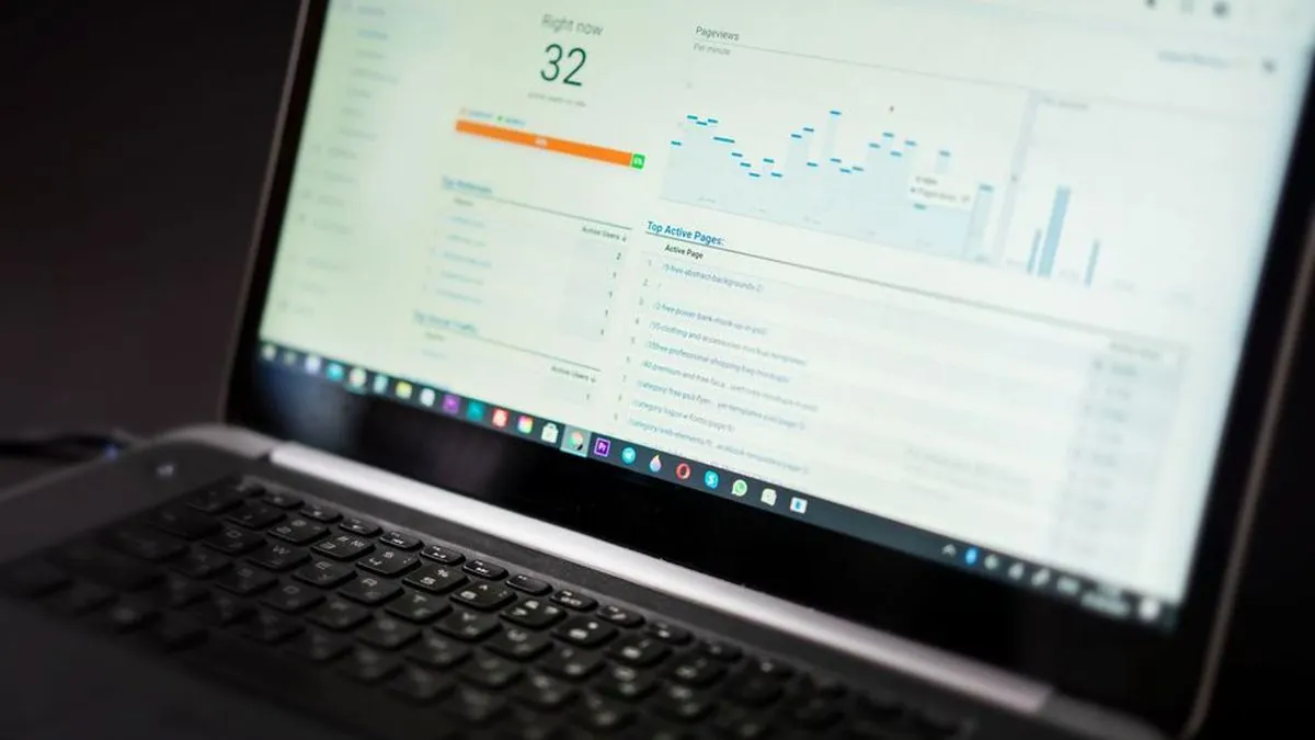 Laptop screen showing a website analytics dashboard with traffic charts