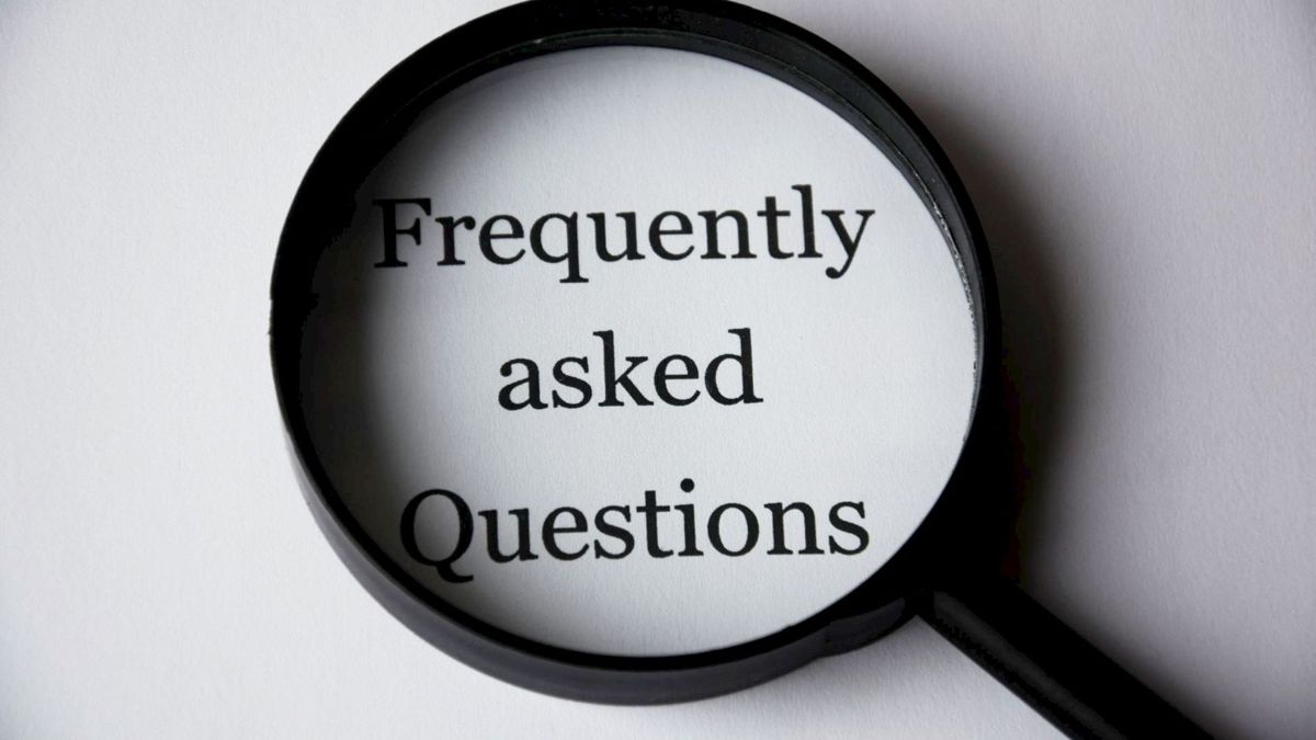 Magnifying glass over the words Frequently asked questions