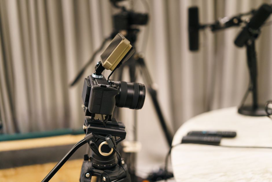 Video camera and microphones set up in a content production studio