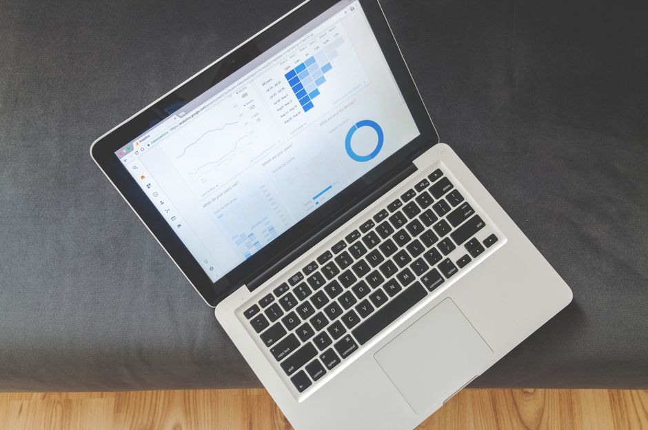 Laptop with marketing analytics dashboard used to review Meta campaign results