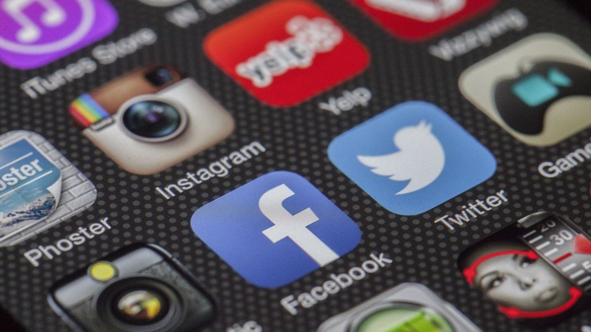Social media app icons on a smartphone screen