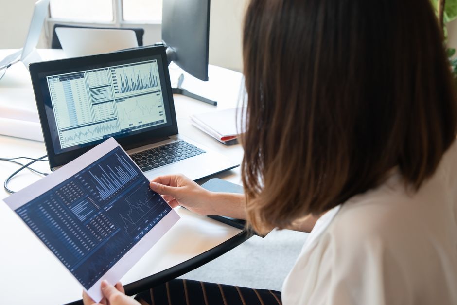 Business owner reviewing local SEO analytics on a laptop