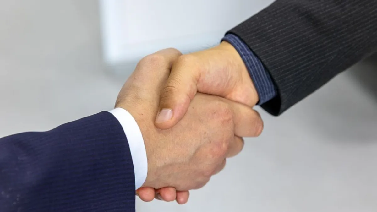 Two business people shaking hands after a meeting