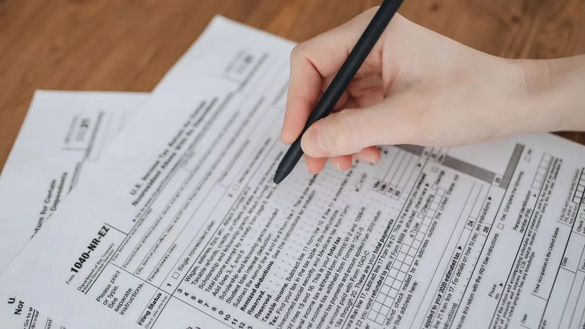Person using a smartphone to fill out an online form