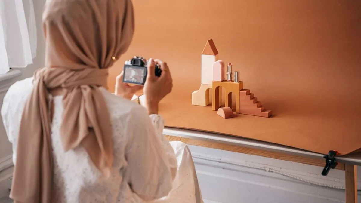 Creator photographing a styled product arrangement with a camera for social media content